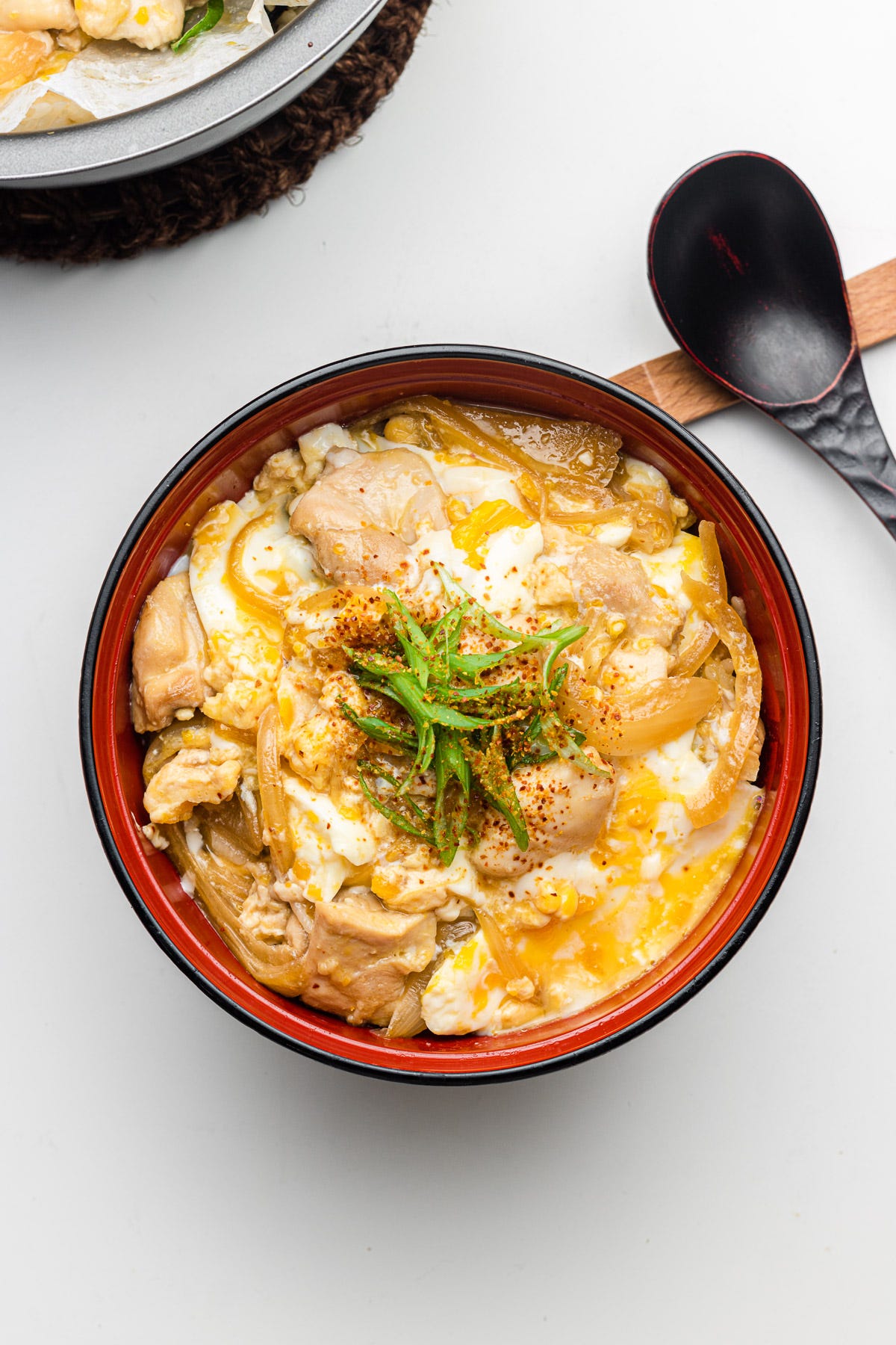 rice cooker oyakodon in a red bowl