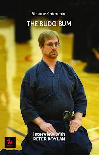 Photo of a bookcover showing a seated swordsman
