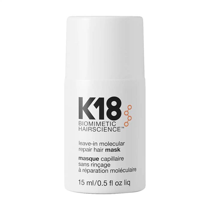 K18 Leave-In Molecular Repair Hair Mask and K18 Molecular Repair Hair Oil bottles side by side for a humidity proof summer hair routine