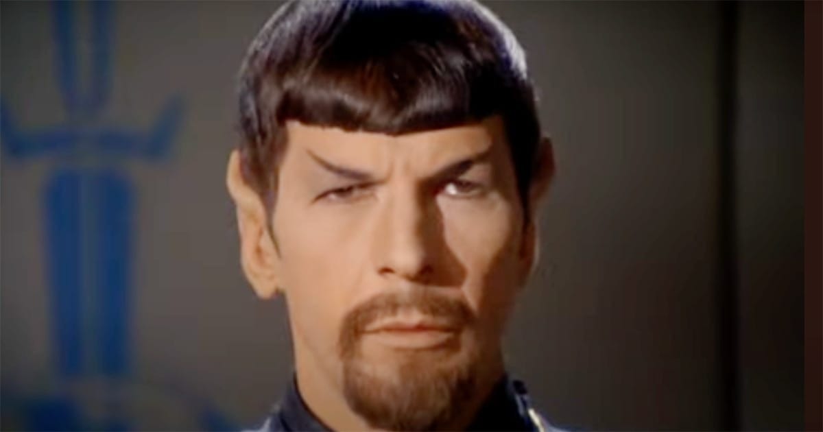 Close-up of Spock from the original Star Trek series, raising one eyebrow with a skeptical expression.