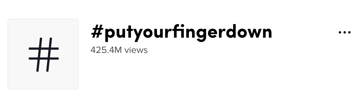 A screenshot of the #putyourfingerdown page on TikTok.