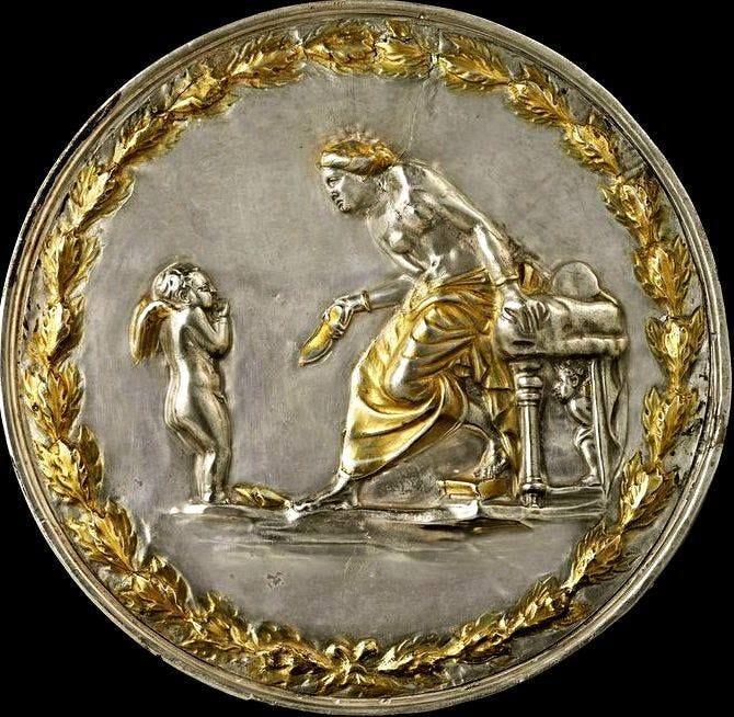 Mixed metals in silver and gold portraying a contrite small Eros before his mother Aphrodite, who is reproaching him with a slipper in her hand. Mixed metals in silver and gold portraying a contrite small Eros before his mother Aphrodite, who is reproaching him with a slipper in her hand.