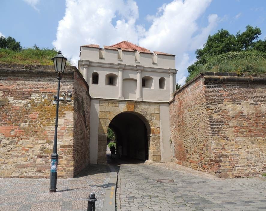 A stone wall with a gate

AI-generated content may be incorrect.