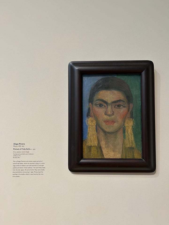 Urban Lights at sunset, Mark Bradford’s 150 Portrait Tone, a mural across a wall with Blank Panthers in it, lunch on a table outside, fluorescent lightblubs on their side on the wall, Magritte's The Treachery of Images, and a painting by Diego Rivera.