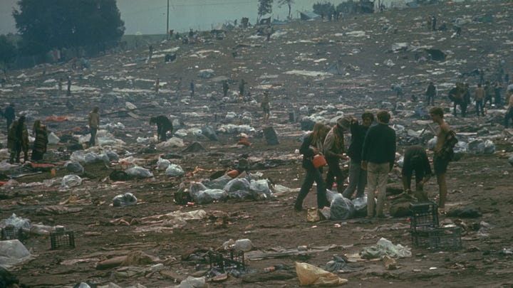Photos of American GI in Vietnam with baby, President Richard Nixon. Woodstock mud pit.
