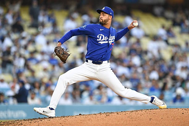 Los Angeles Dodgers pitcher Antoine Kelly throws a pitch during the MLB Spring Training game between the Los Angeles Angels and the Los Angeles...