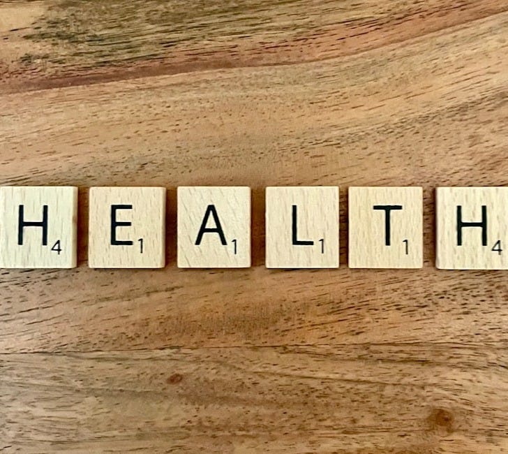 a group of white boxes with black text on a wooden surface