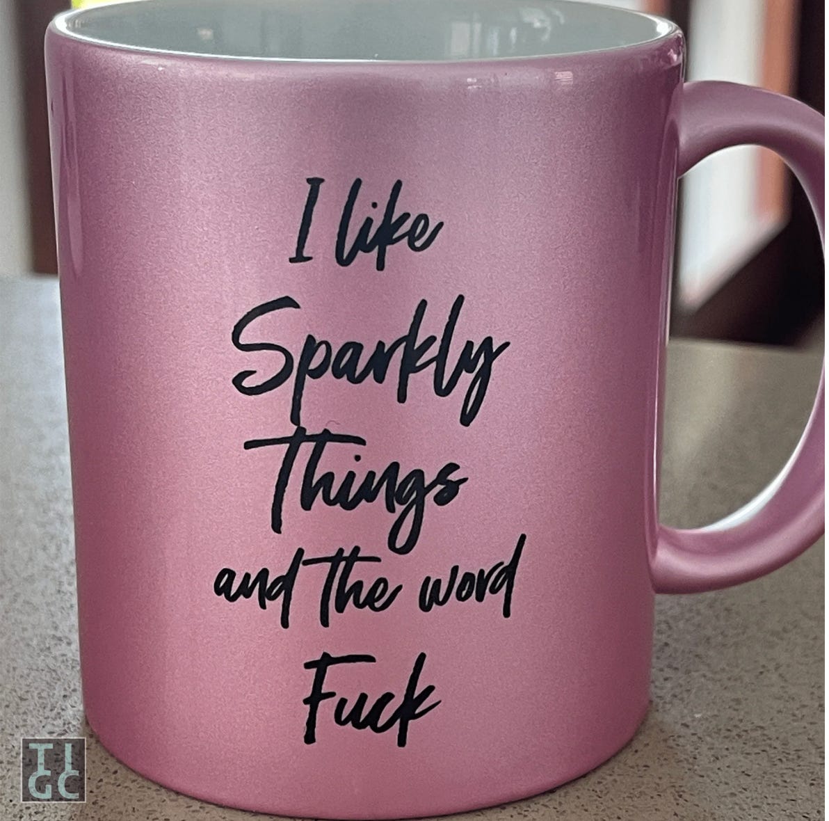 Sparkly pink mug that reads 'I like sparkly things and the word fuck.'