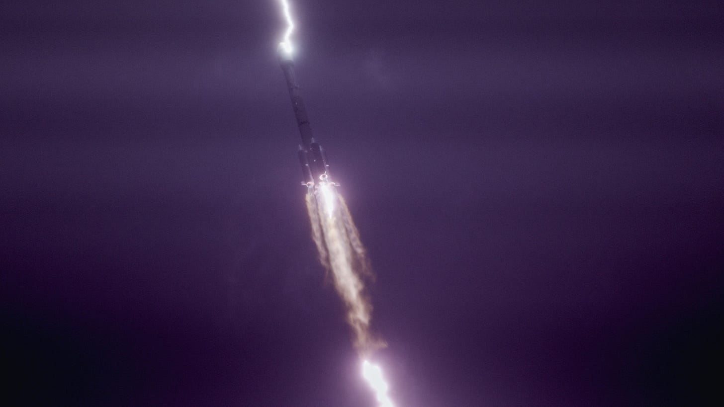 lightning strikes a rocket in the sky