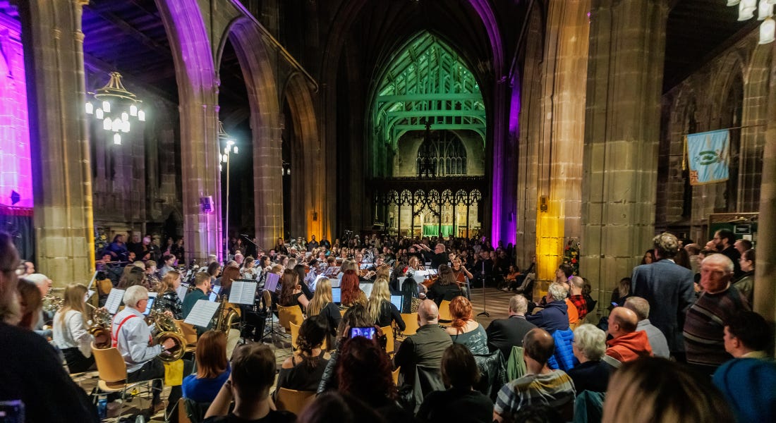 A church with an orchestra in it and colourful lights A church with an orchestra in it and colourful lights