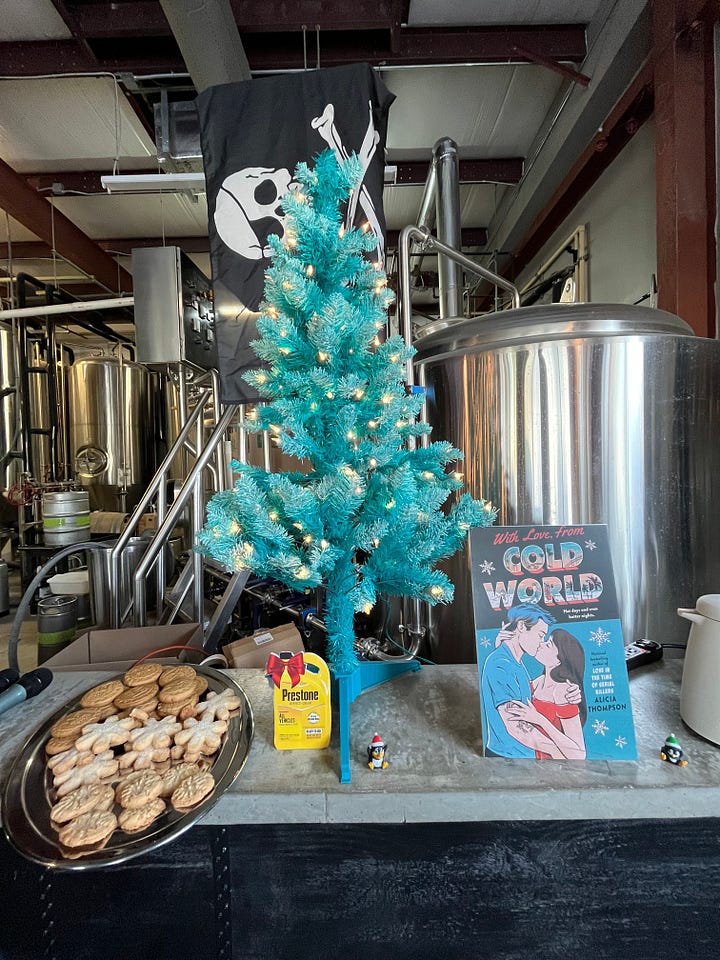 Left: the plate of cookies, tree, coolant cutout, penguins, and book cover in front of a pirate flag and a bunch of brewery stuff; Right: the wooden cutout snow globe for photo ops!