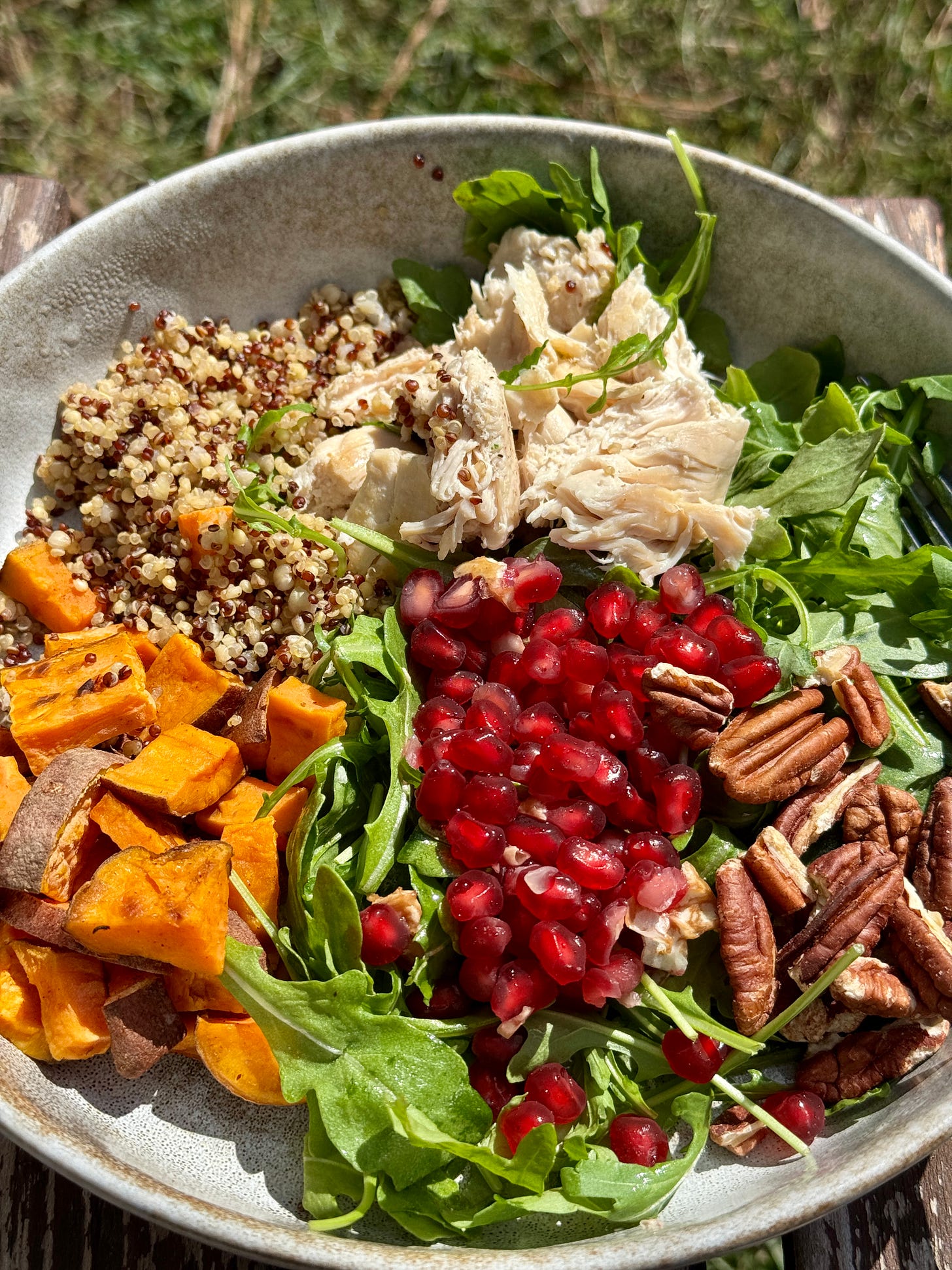 Arugula nourish bowl with grilled chicken