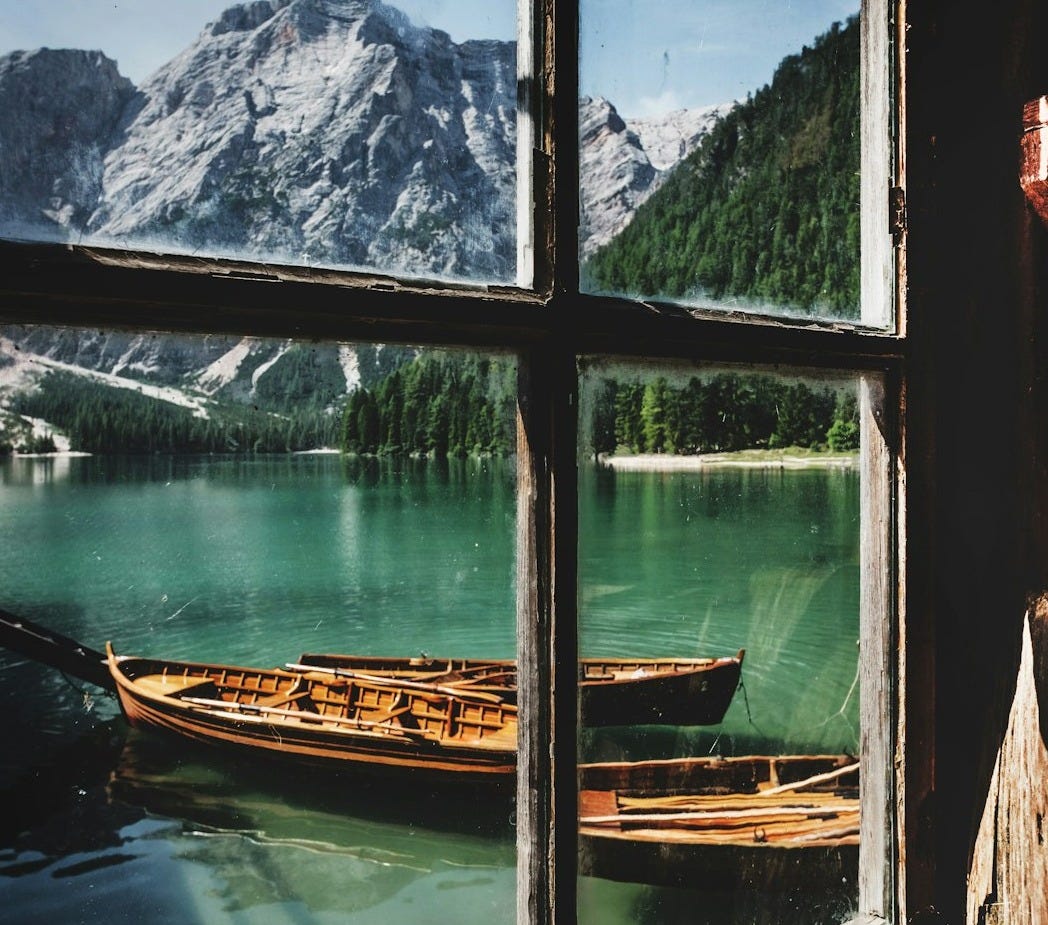 four brown wooden boat near dock