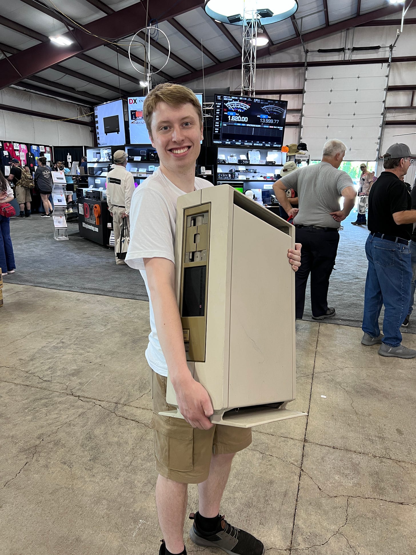 Adam Zimmel W0ZML and a new treasure at Hamvention 2026. Image courtesy of Steve Stroh N8GNJ.