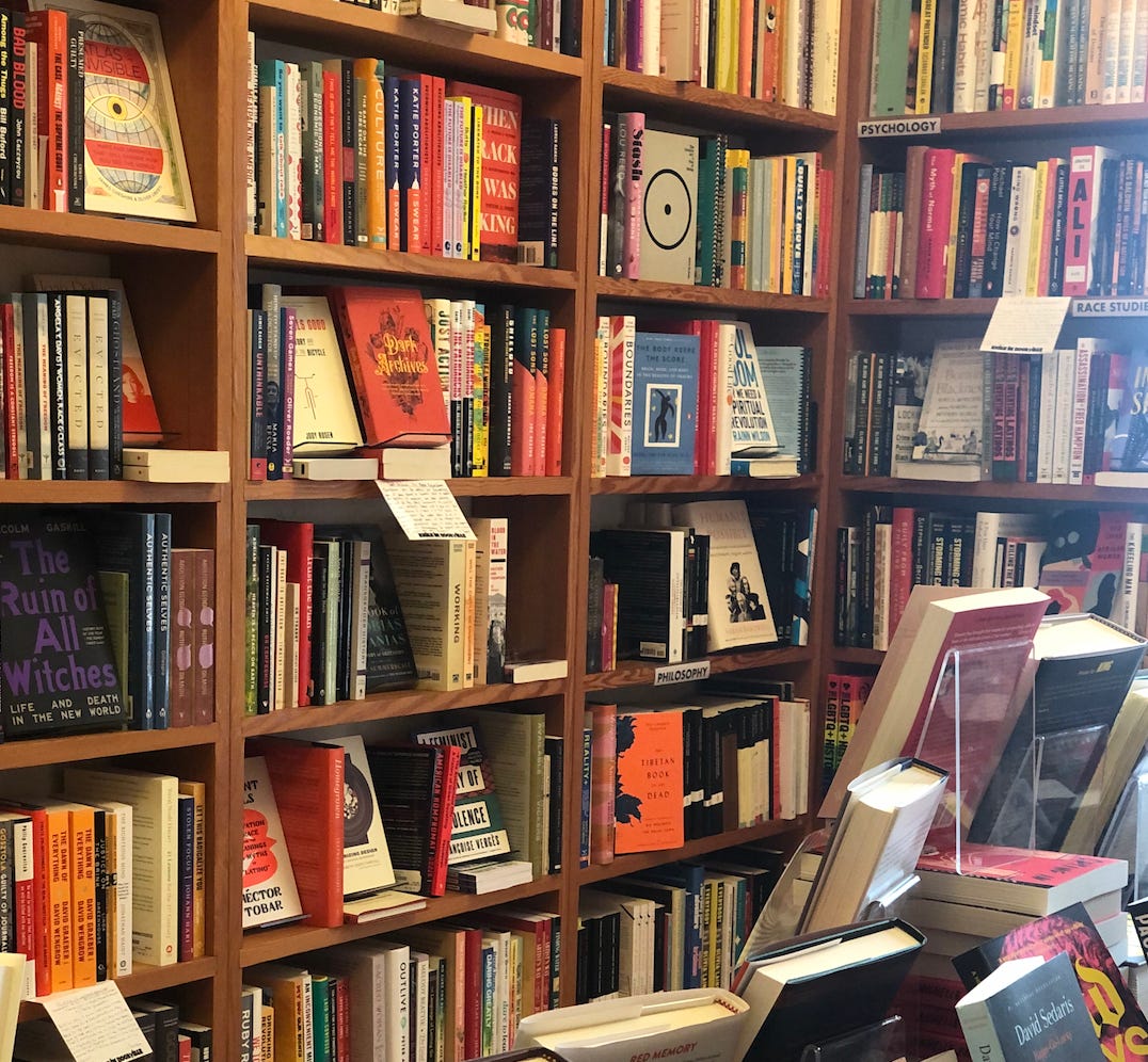 Floor to ceiling bookshelves at a bookstore.