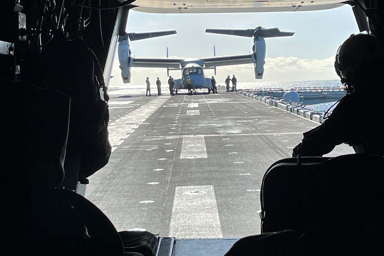An aircraft lands on a vessel.