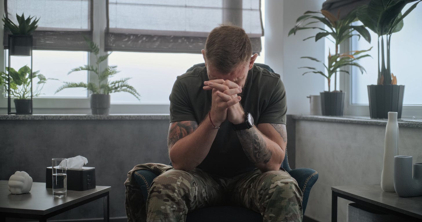 Dolly shot of depressed military man with contusion or PTSD sitting in chair, crying, talking and sharing negative feelings during therapy session with psychotherapist. Post traumatic stress disorder.