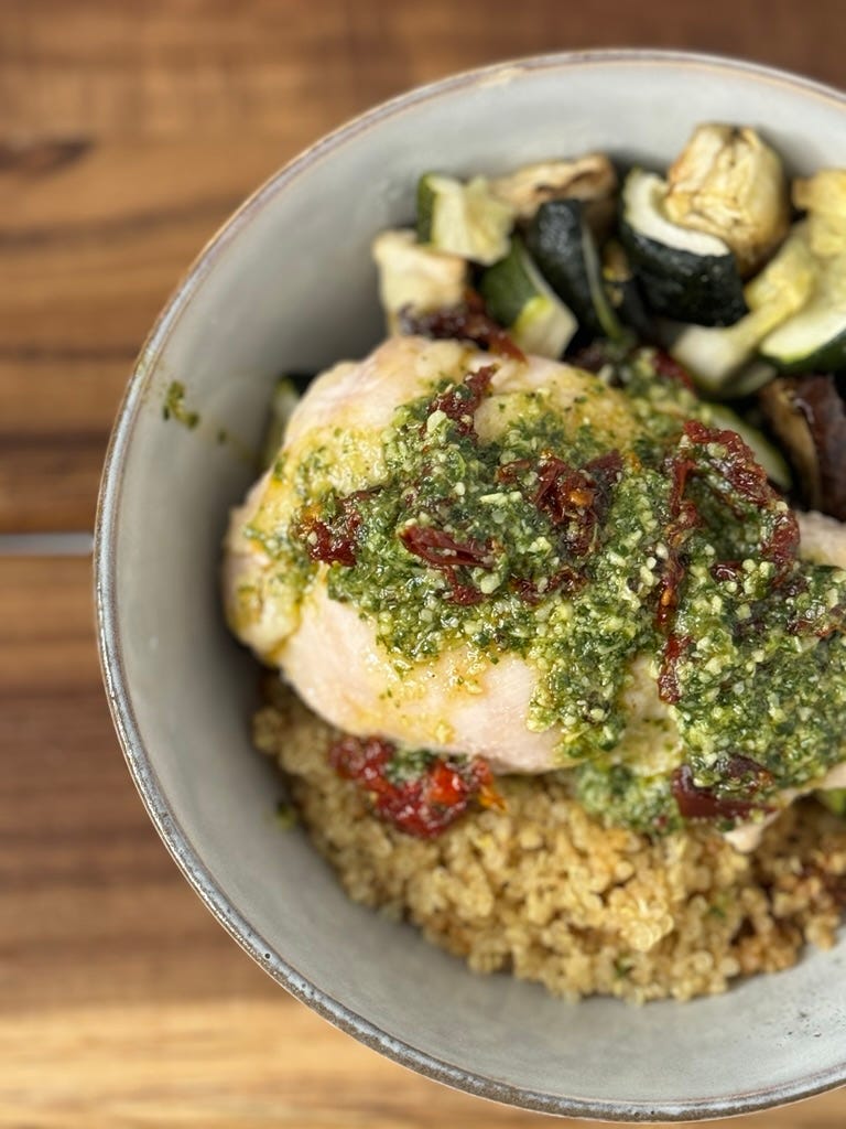 quinoa bowl with chicken, pesto, and veggies