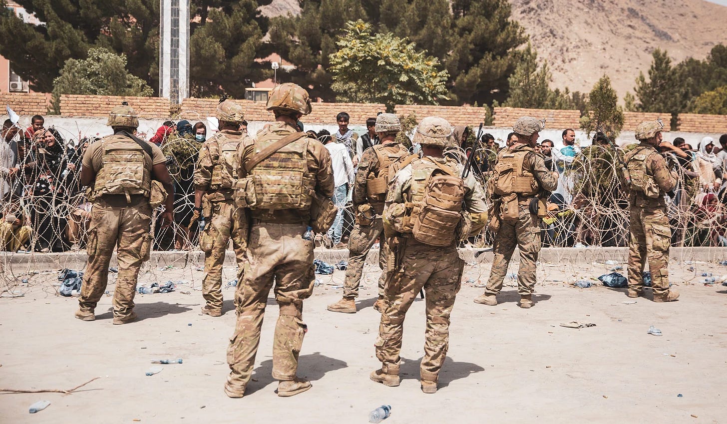 A group of soldiers walking

Description automatically generated with medium confidence