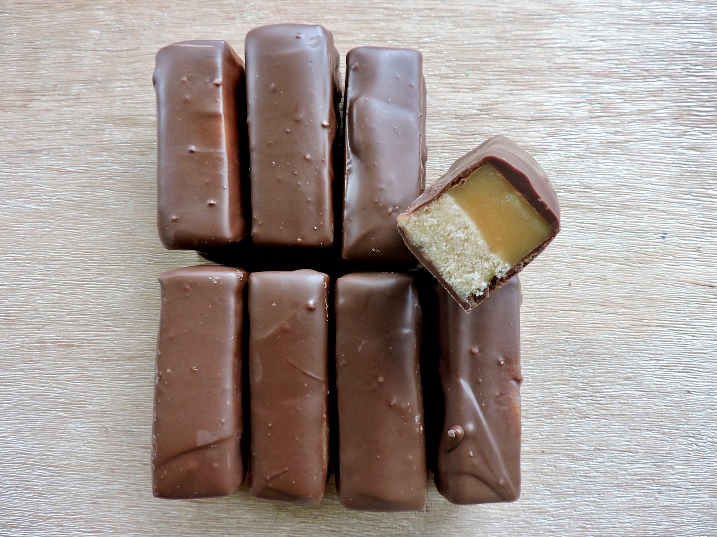  A tender shortbread cookie base topped with chewy caramel and dipped in chocolate. 