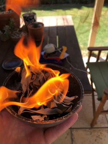A hand holding a bowl with fire
AI-generated content may be incorrect.