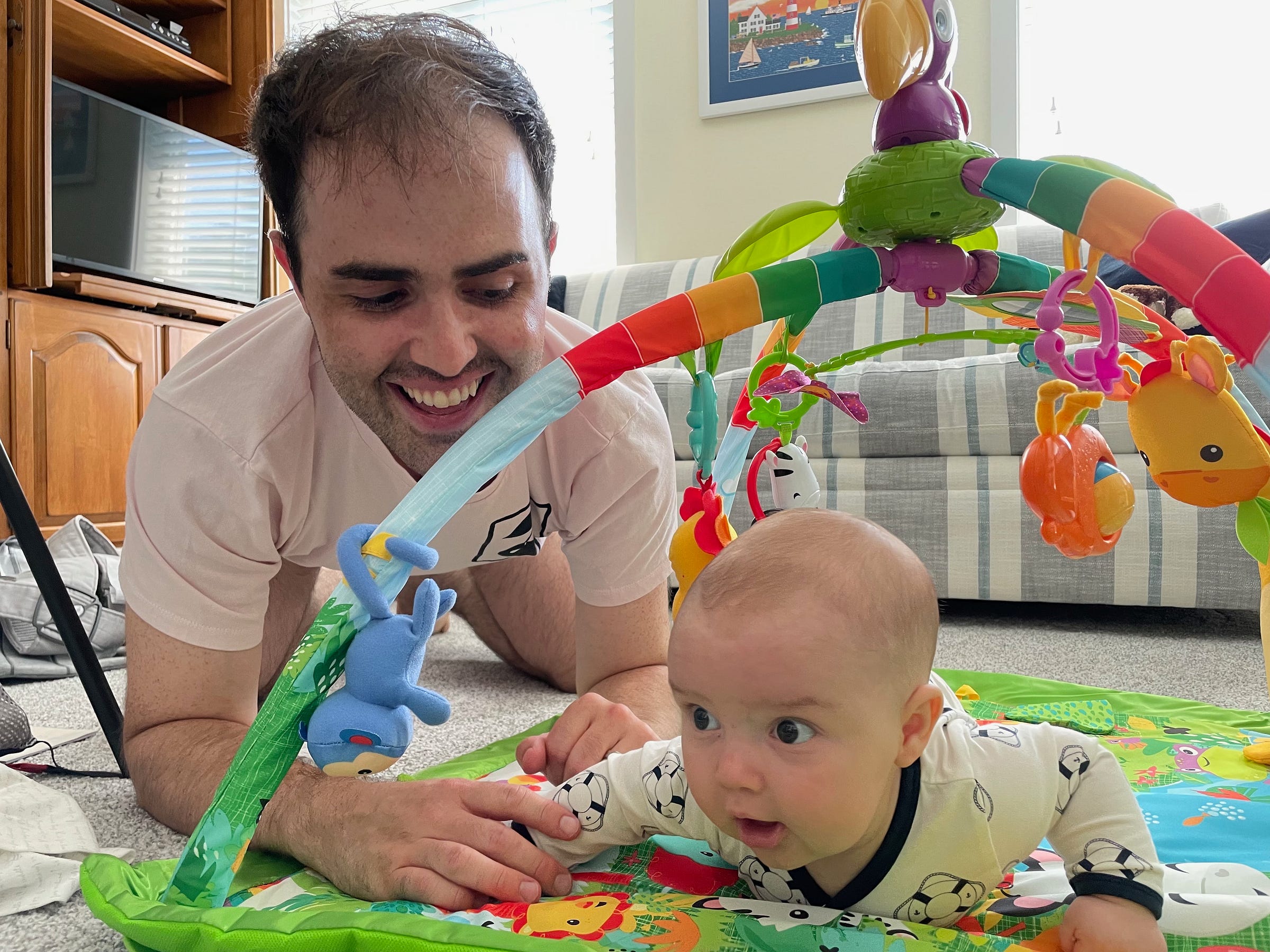 John with his son on the floor playing