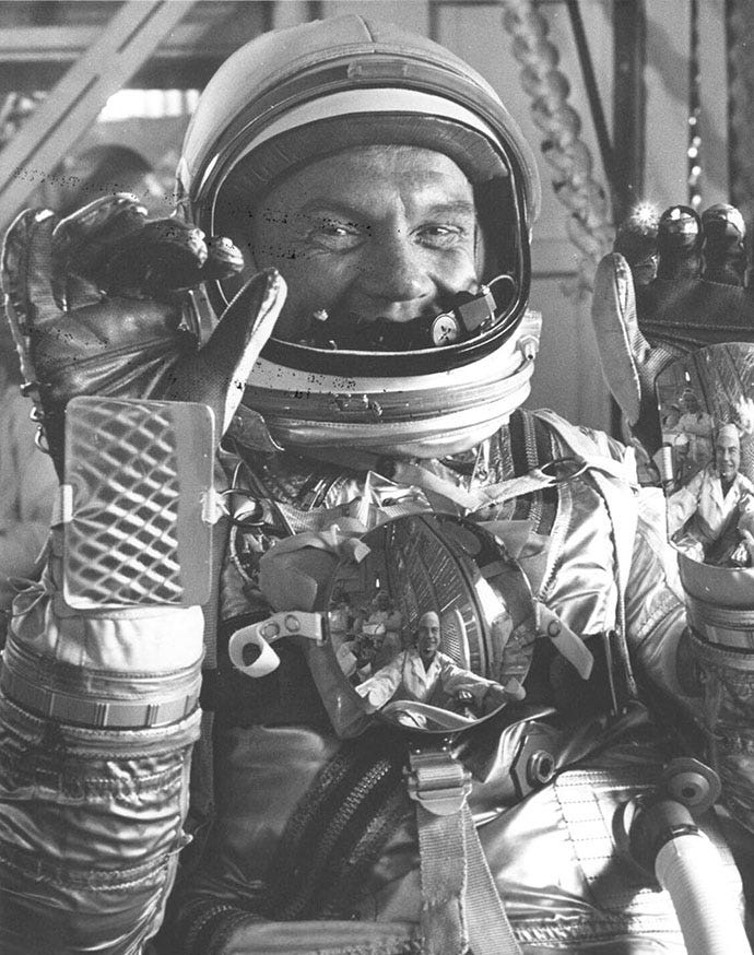 Photograph of Astronaut John Glenn Being Helped into His Mark VI Pressure Suit, January 23, 1962 | National Archives Photograph of Astronaut John Glenn Being Helped into His Mark VI Pressure Suit, January 23, 1962 | National Archives