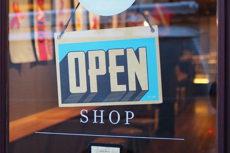 “open” sign on a shop window “open” sign on a shop window
