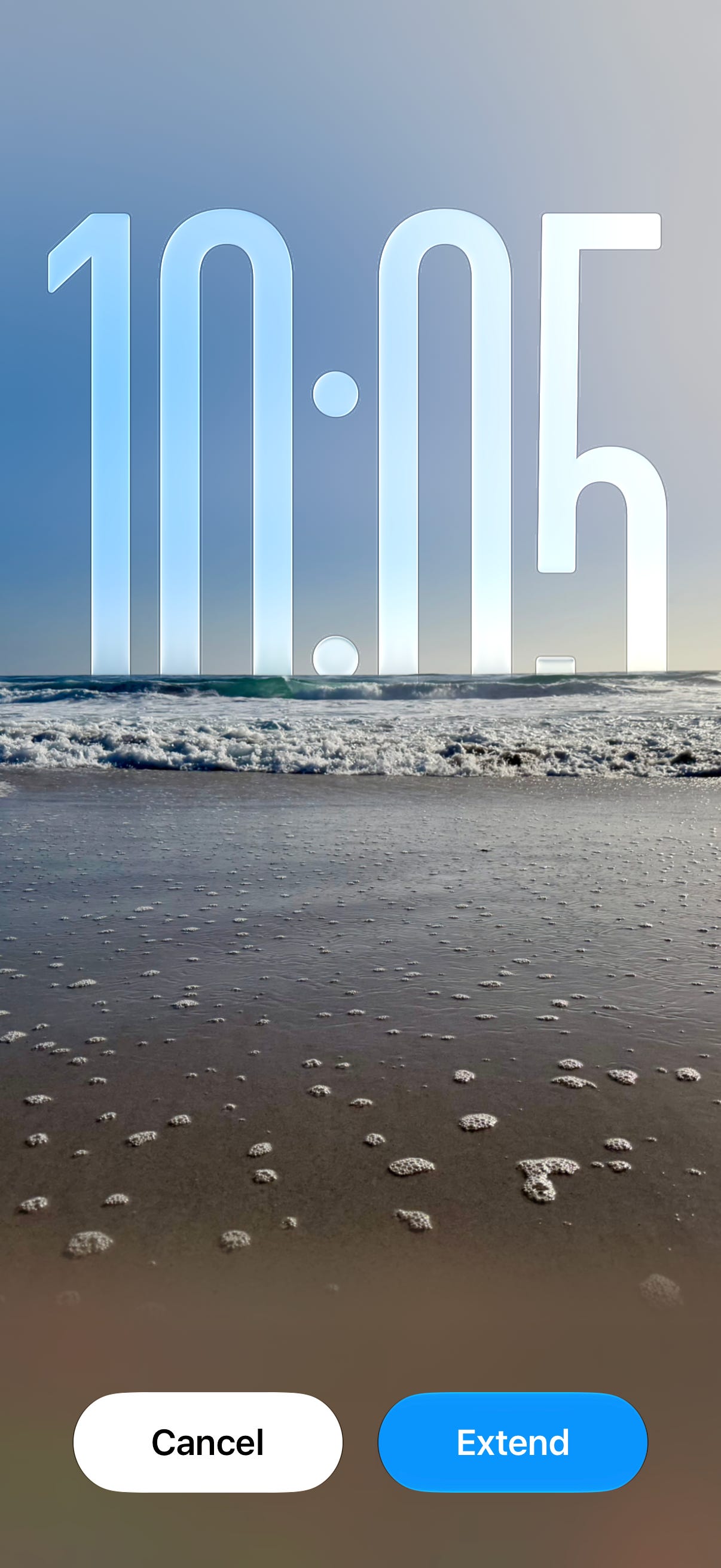 Screenshot of the Photos app using Extend to expand a beach photo beyond its original frame so it can be used as a lock screen wallpaper without cropping the image. Screenshot of the Photos app using Extend to expand a beach photo beyond its original frame so it can be used as a lock screen wallpaper without cropping the image.