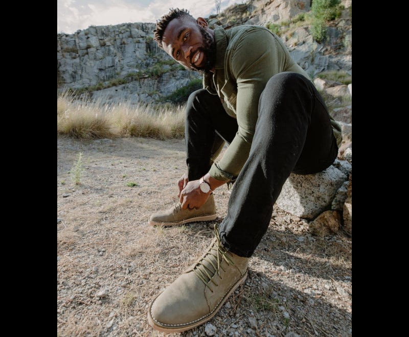 Siya Kolisi wearing Freedom of Movement's Vellies shoe range.