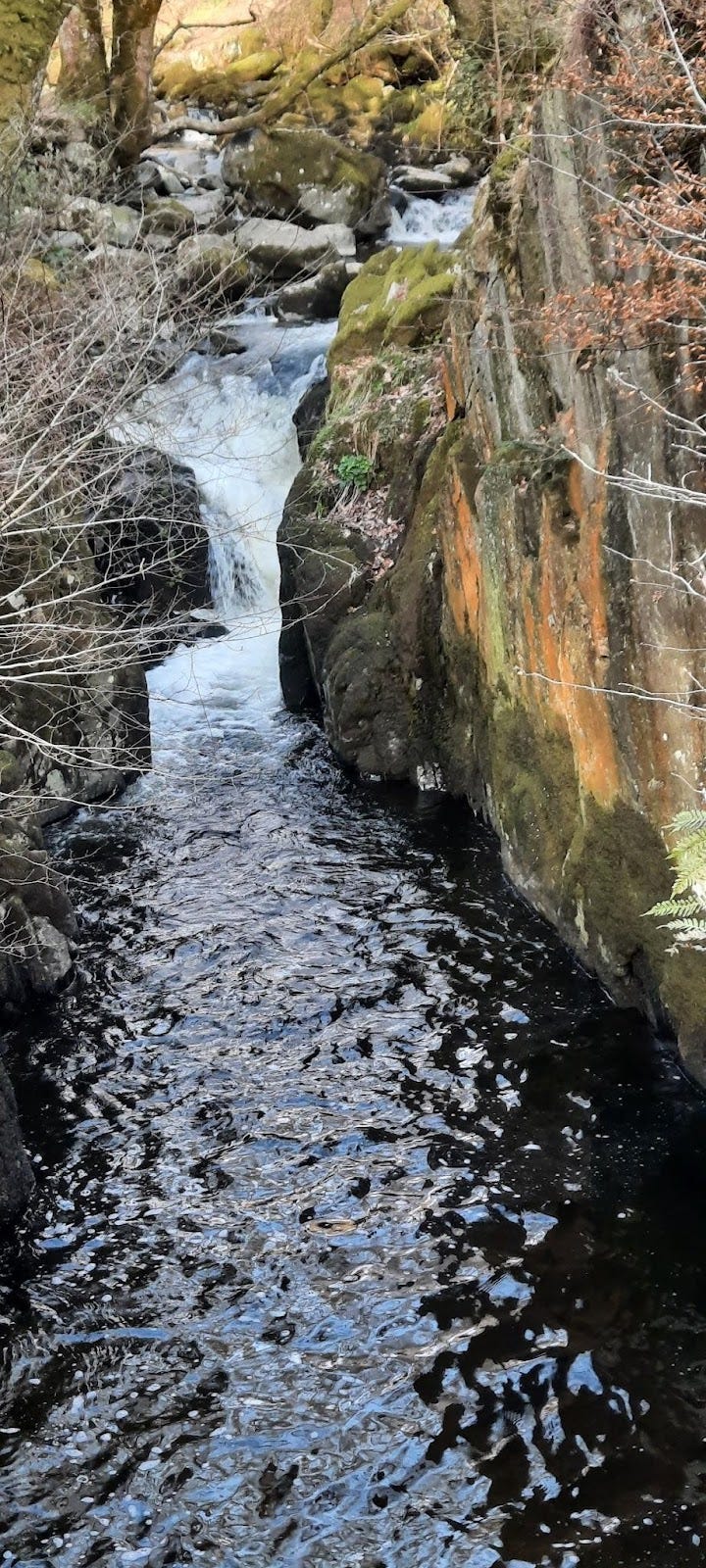 Waterfall with colored rocks