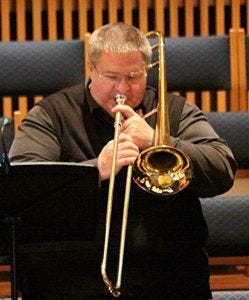 Rob Hampson playing the trumpet. Rob Hampson playing the trumpet.