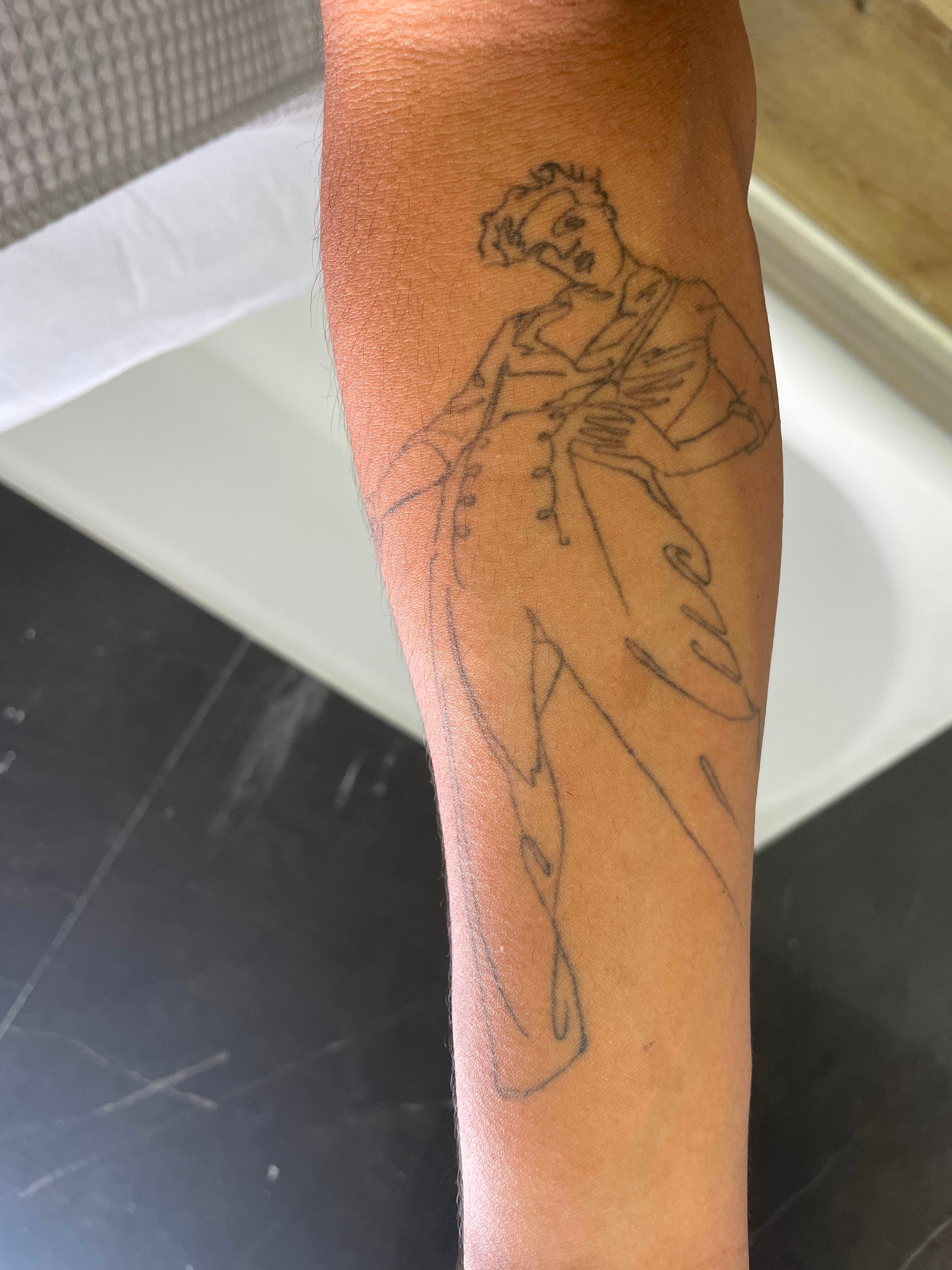 Fine Line Tattoos Paying Homage to Harry Styles