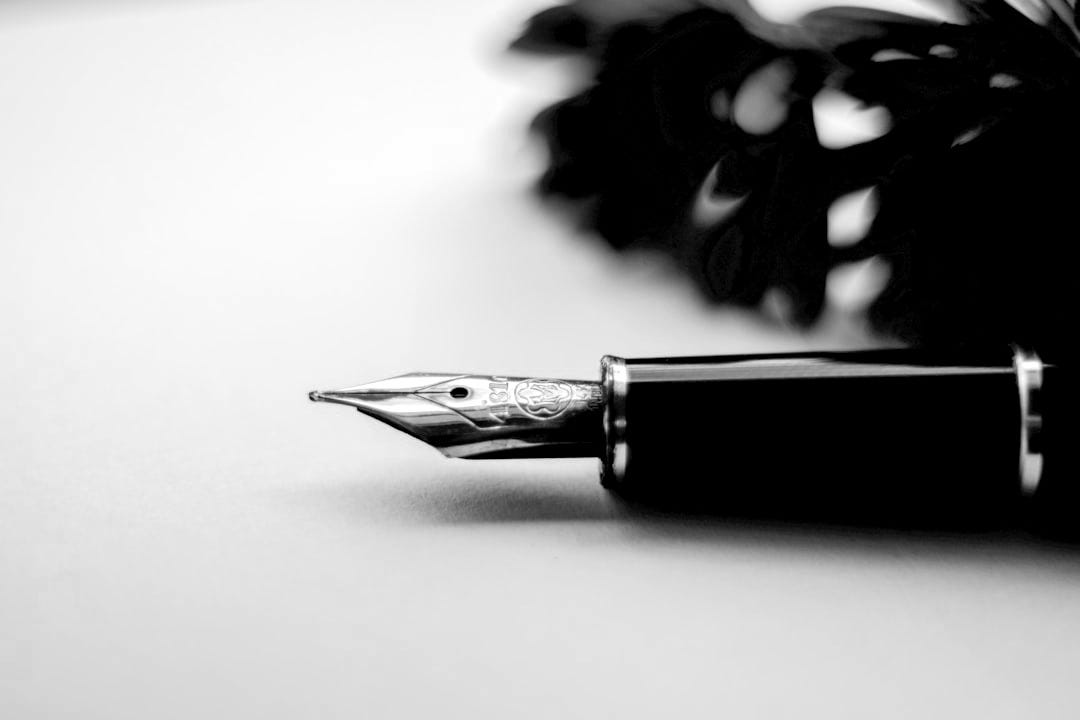 shallow focus photography of fountain pen