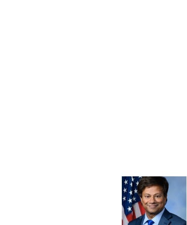 A person in a suit and tie

Description automatically generated