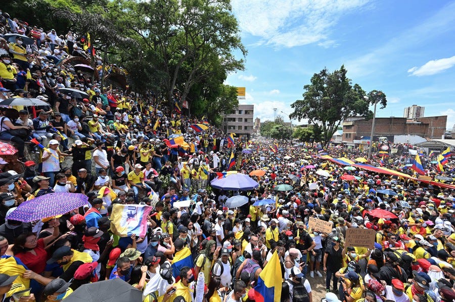 A very large group of people gathers for a protest.