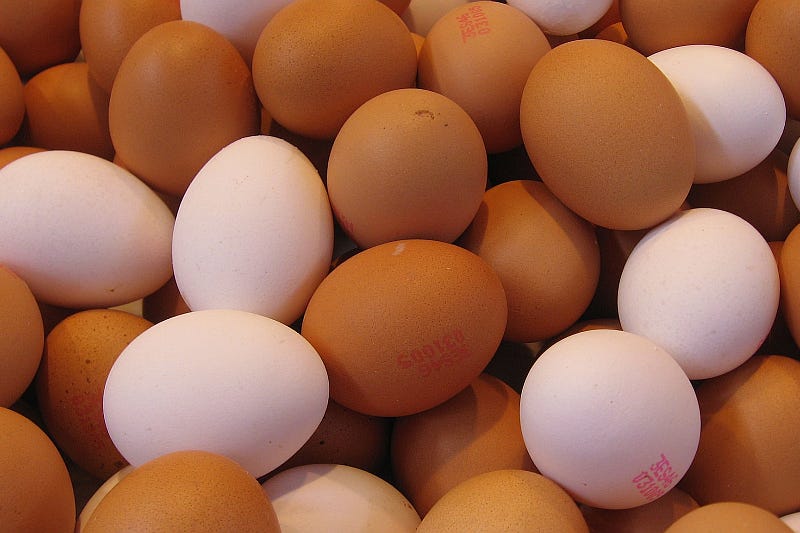 A bunch of brown and white eggs