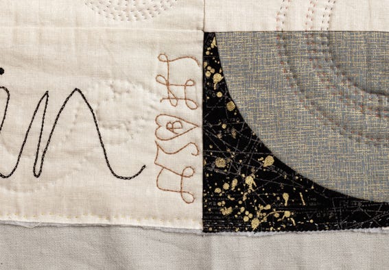 The initials of Henry VIII with AB in a heart - quilted onto cream fabric