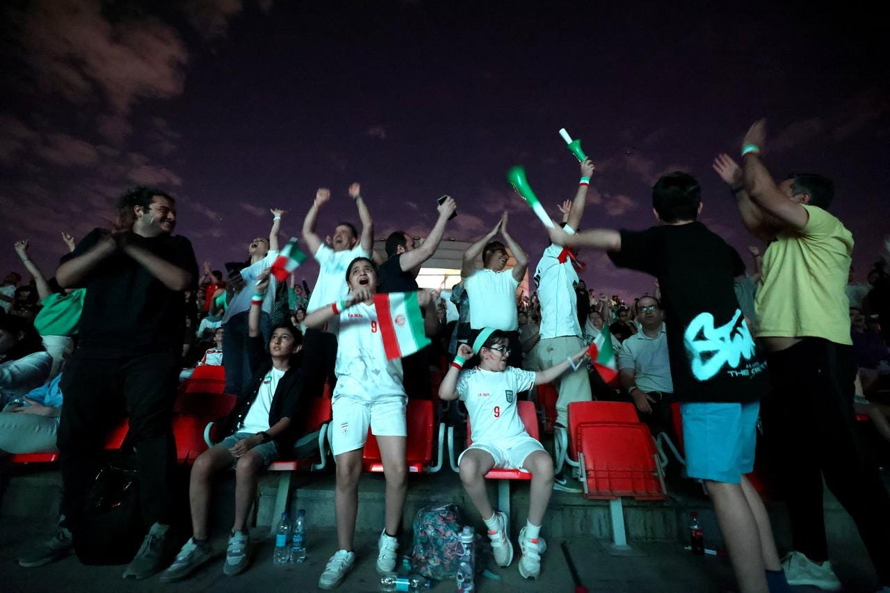 Iranian soccer fans cheer as they watch a broadcast of the 2026 World Cup Group G football match between Belgium and Iran in Tehran, Iran, on June 21, 2026. (AFP Photo)