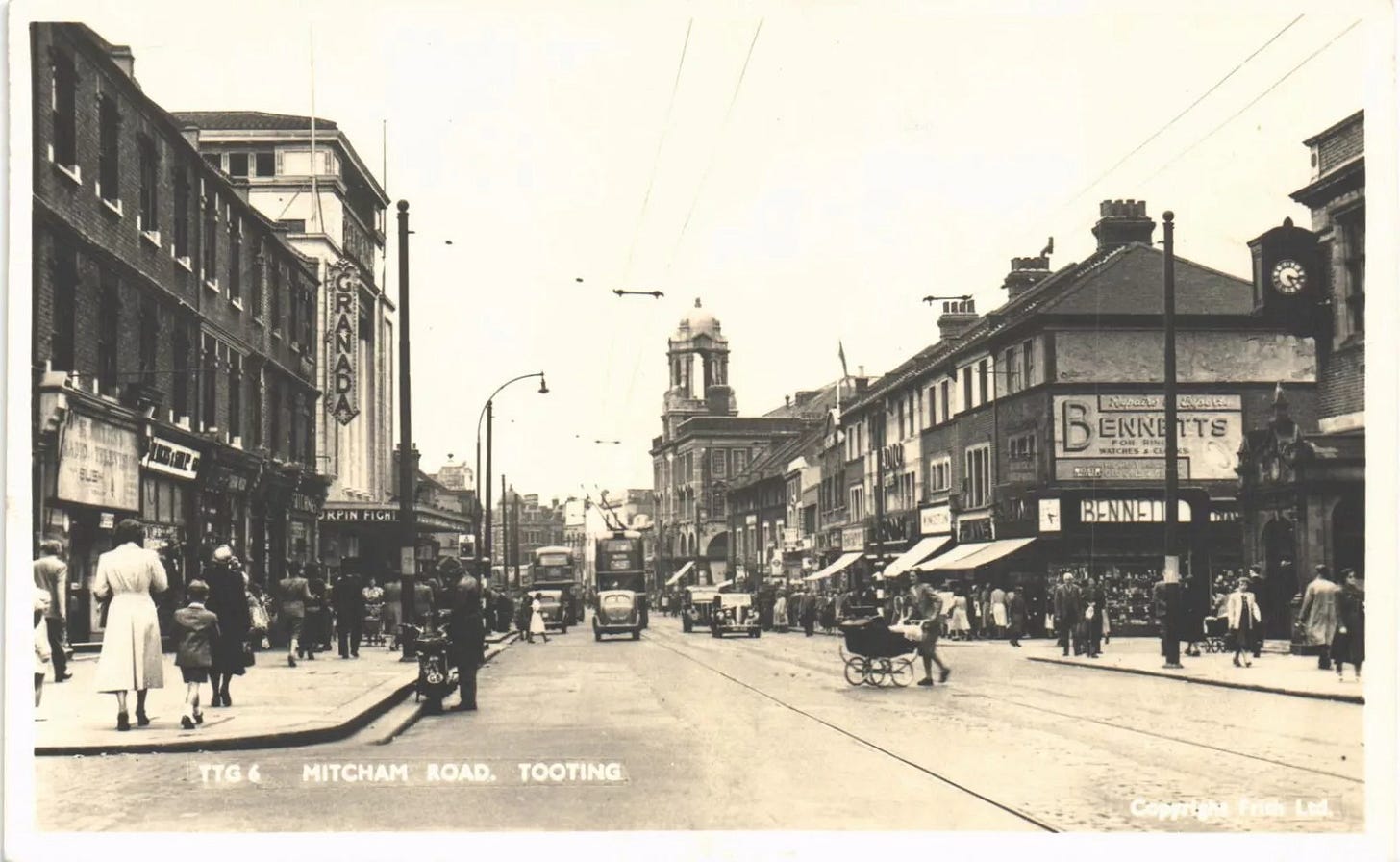 May be an image of 12 people, tram, street and text