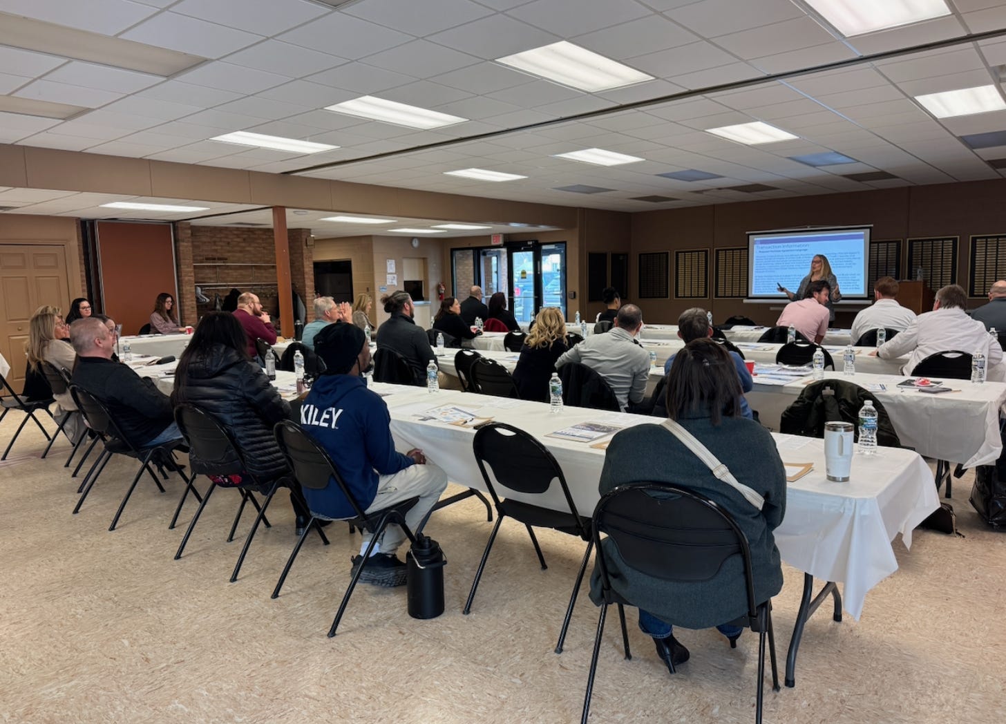 A room full of REALTORS® investing in knowledge ahead of regulatory change. Professionalism begins with preparation.