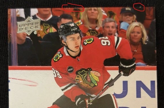 Example of edge chipping for PSA grading on 2024 Connor Bedard Upper Deck Young Guns rookie card. Example of edge chipping for PSA grading on 2024 Connor Bedard Upper Deck Young Guns rookie card.