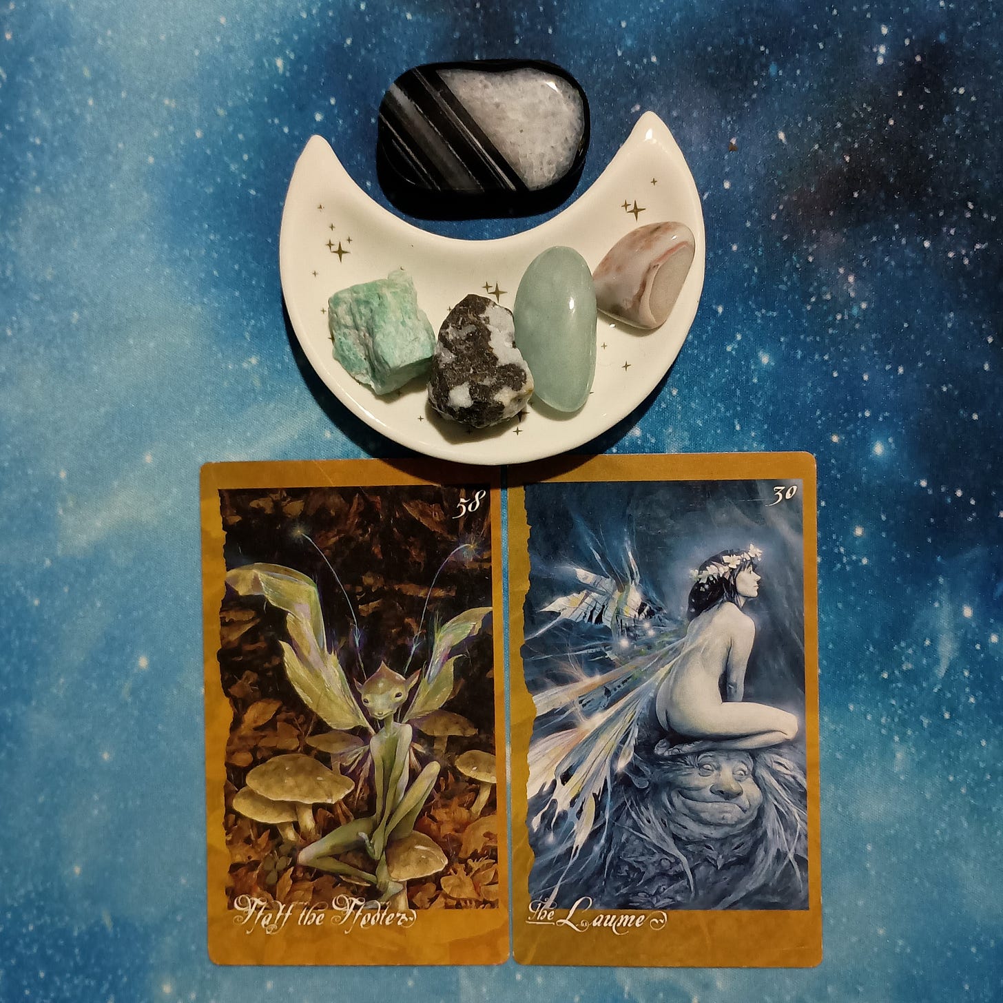 Giving Makes a Happy Heart! ~ A Message From the Universe, 2 Faeries' Oracle cards and crystals on a starry blue background