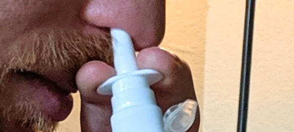 Inhaling a homemade COVID-19 vaccine.