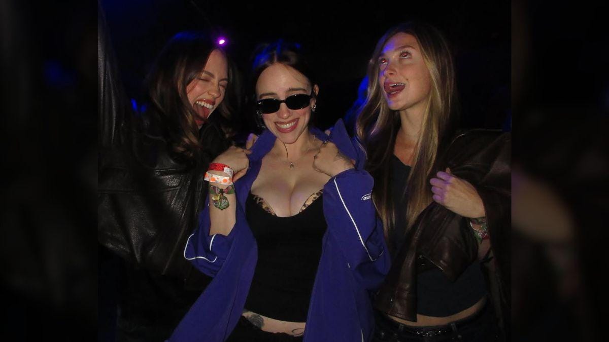 Photo of Billie Eilish sported a plunging top and low rise pants for an outing with her friends. Photo of Billie Eilish sported a plunging top and low rise pants for an outing with her friends.
