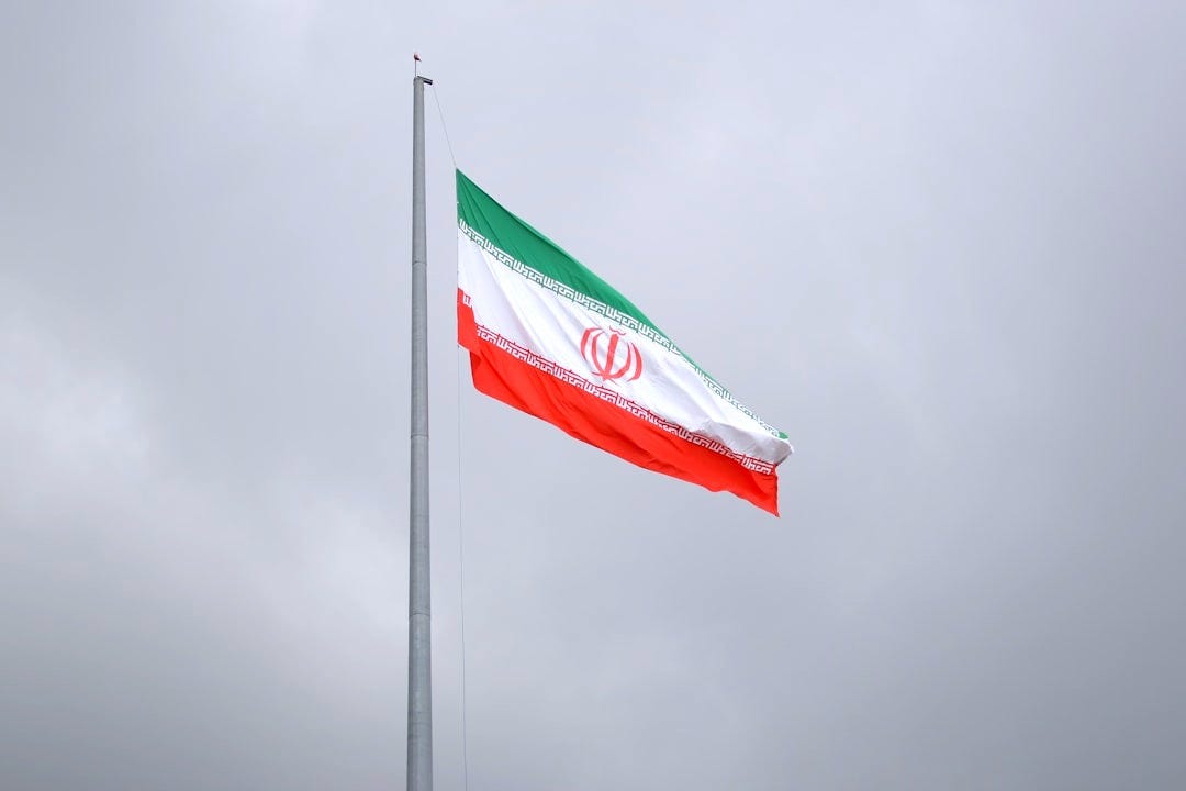 A flag flying in the wind on a cloudy day