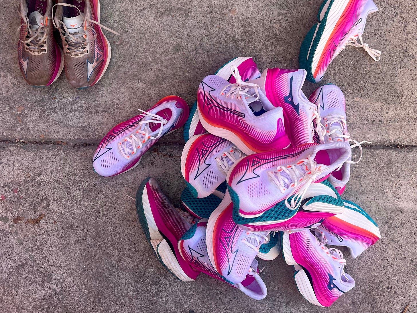 A photo of a pile of shoes. A photo of a pile of shoes.