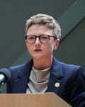 Bev Craig speaking into a microphone at a lectern