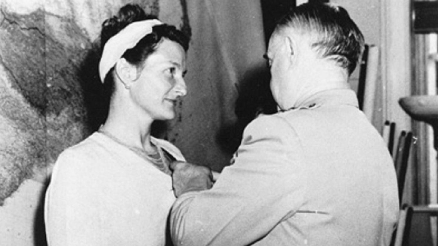 Virginia Hall receiving the Distinguished Service Cross from Major General William Donovan, September 1945.