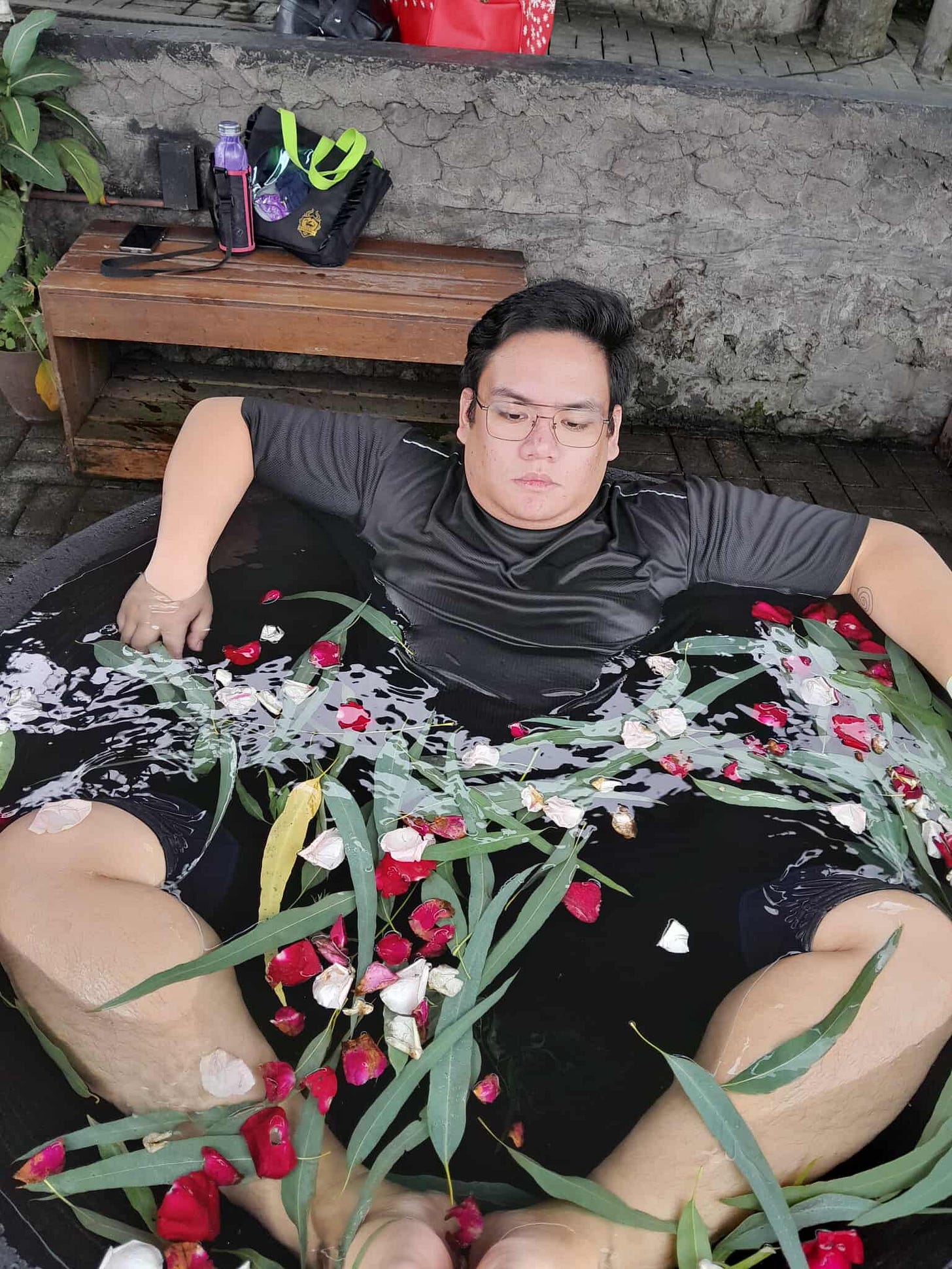 My brother relaxing in his kawa bath.